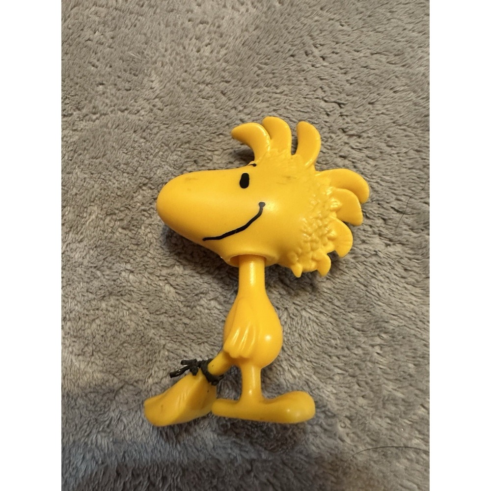 Woodstock bobblehead toy, specifically a 2015 McDonald's Happy Meal